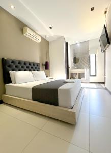 Postel nebo postele na pokoji v ubytování Hotel 47 Medellin Center