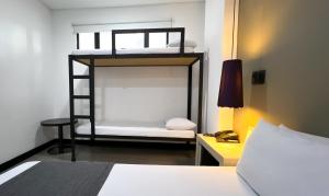 Postel nebo postele na pokoji v ubytování Hotel 47 Medellin Center