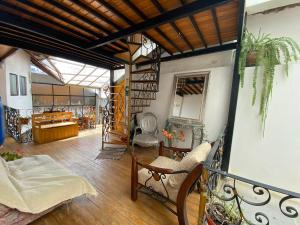 a living room with a balcony with a fireplace at Minidepa hermosa vista - H. El Casero in Cajamarca +18 photos