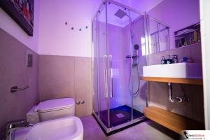 a bathroom with a shower and a toilet and a sink at ToledoStation B&B in Naples +138 photos