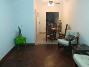 a living room with a couch and chairs and a table at CasitaLibertad in Villa Augusta