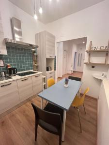 a kitchen and dining room with a table and chairs at Step by Rome apt in Rome