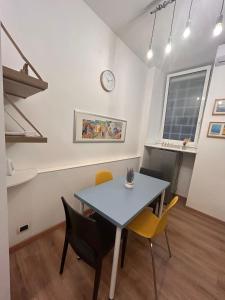 a dining room with a table and chairs at Step by Rome apt in Rome