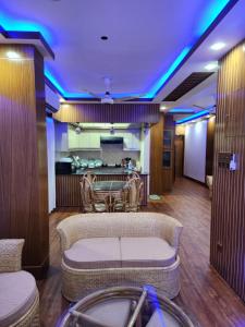 a lobby with a waiting room with blue lights at Entire 1 BED ROOM Studio Apartment Uttara 14 in Dhaka +131 photos