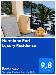 een flyer voor een luxe accommodatie in een haven met een mand sinaasappels op bij Hermione Port Luxury Residence in Ermioni