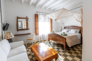 Ένα ή περισσότερα κρεβάτια σε δωμάτιο στο Ibiza Boutique Guest House +45 φωτογραφίες