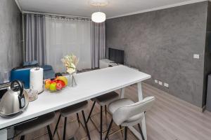 Un televizor și/sau centru de divertisment la Appartement moderne, proche du Parc de la tête d'Or et de Lyon