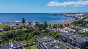 an aerial view of a city and the ocean at Beach & Garden Apartment in Ponta Delgada