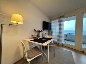 Μια τηλεόραση ή/και κέντρο ψυχαγωγίας στο Kleines Seeapartment +4 φωτογραφίες