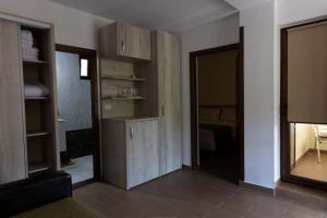a living room with wooden shelves and a mirror at ANCA in Saturn +31 photos