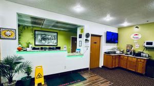 a waiting room at a hospital with a counter at Forest City Inn in Forest City