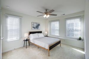 a bedroom with a bed and a ceiling fan at Modern Oasis in Beulah Village