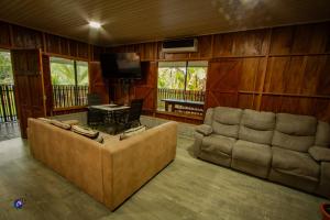 a living room with a couch and a table at Chepe's Chic Bungalow in Fortuna