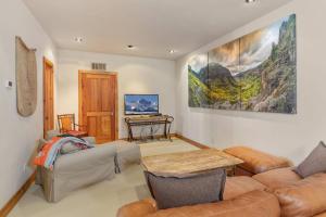 a living room with a couch and a table at Elk View Lodge in Telluride