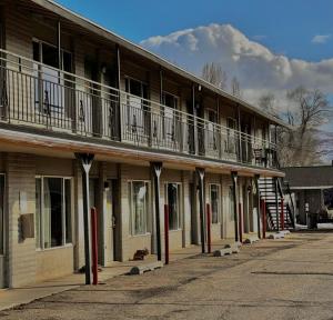 a row of buildings with balconies and stairs on them at Heber Inn in Heber City