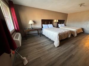 Ένα ή περισσότερα κρεβάτια σε δωμάτιο στο Clintonville Motel