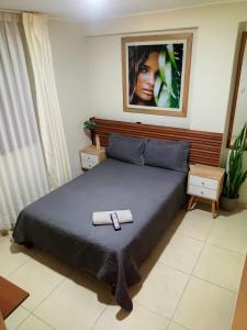 A bed or beds in a room at Hotel Kallma Adventures