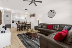 a living room with a couch and a table at Home away from home near Disney! in Kissimmee