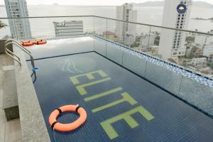 a swimming pool on the roof of a building at Elite Hotel Nha Trang in Nha Trang
