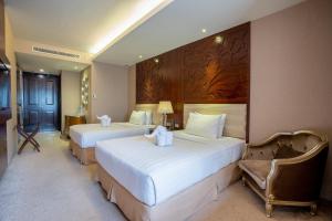 Katil atau katil-katil dalam bilik di Belviu Hotel Bandung