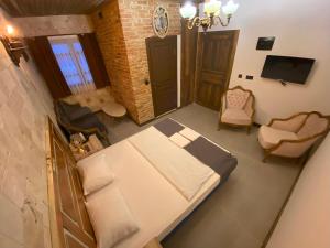 an overhead view of a bedroom with a bed and chairs at konak esila in Usak