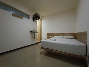 En eller flere senge i et værelse på HOTEL CASA GIRARDOT