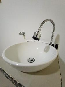 a white sink with a faucet on a counter at HOTEL CASA GIRARDOT in Medellín