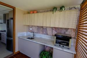 A cozinha ou cozinha compacta de Casa 19 da Vila Beija Flor