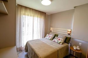 Cama ou camas em um quarto em Casa 19 da Vila Beija Flor