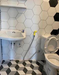 a bathroom with a toilet and a sink at B2 Hotel Savannakhet in Savannakhet