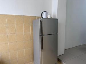 a refrigerator in the corner of a kitchen at C4A Austin Toppen IKEA Aeon Tebrau in Johor Bahru