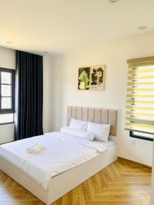 Postel nebo postele na pokoji v ubytování Villa Ngọc Trai Biển tại Novaworld Phan Thiết + 22 fotografií