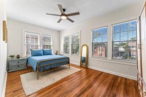 a bedroom with a bed and a ceiling fan at Best Location In San Marco! Walkable shopping&fun! in Jacksonville