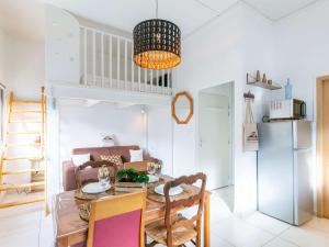 a living room with a table and a couch at Studio Bourisp, 1 pièce, 4 personnes - FR-1-296-495 in Bourisp