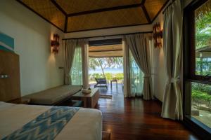 Кровать или кровати в номере Tup Kaek Sunset Beach Resort-SHA Plus
