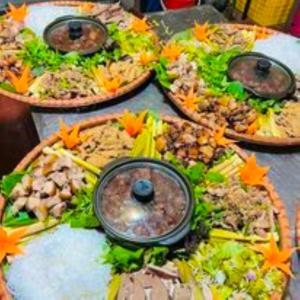 a table topped with three pizzas with different toppings at Nậm Thia Homestay in Yên Bái +58 photos