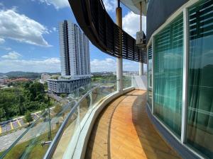 a balcony of a building with a view of a city at D Gateway Perdana Hotel Bangi in Bangi