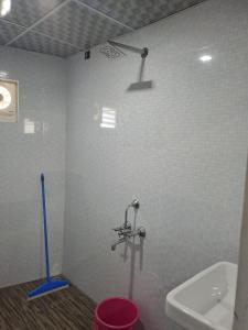 a bathroom with a sink and a faucet at Galeela Plaza in Tāmarakulam +19 photos