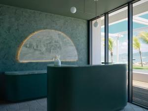 a room with a table with a view of the ocean at Ardo in Townsville