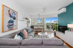 a living room with a couch and a table at Resort on the Beach Dual Unit 5203 in Kingscliff