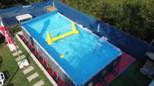 an overhead view of a large swimming pool at Vikendica VILLA A1 in Banja Luka