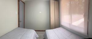 Cama ou camas em um quarto em Arriendo casa nueva en Pucon! Casa 6 personas