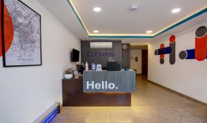 an office lobby with a hello sign on the wall at Treebo Trend FlxHo Trio - Medanta Medicity Gurgaon in Gurgaon