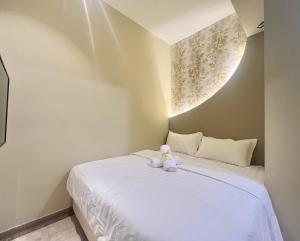 Ένα ή περισσότερα κρεβάτια σε δωμάτιο στο Asimmy Hotel