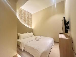 TV a/nebo společenská místnost v ubytování Asimmy Hotel
