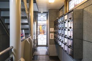 a hallway in a building with a bunch of animal exhibits at 702 道頓堀側のお部屋 中心地へのアクセス抜群 ダブルベッド1台 in Osaka