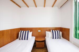 Posteľ alebo postele v izbe v ubytovaní Hotel Casa Mas