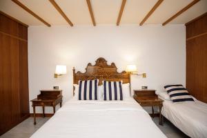 Posteľ alebo postele v izbe v ubytovaní Hotel Casa Mas