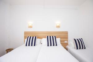 Posteľ alebo postele v izbe v ubytovaní Hotel Casa Mas