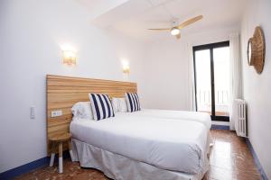 Posteľ alebo postele v izbe v ubytovaní Hotel Casa Mas